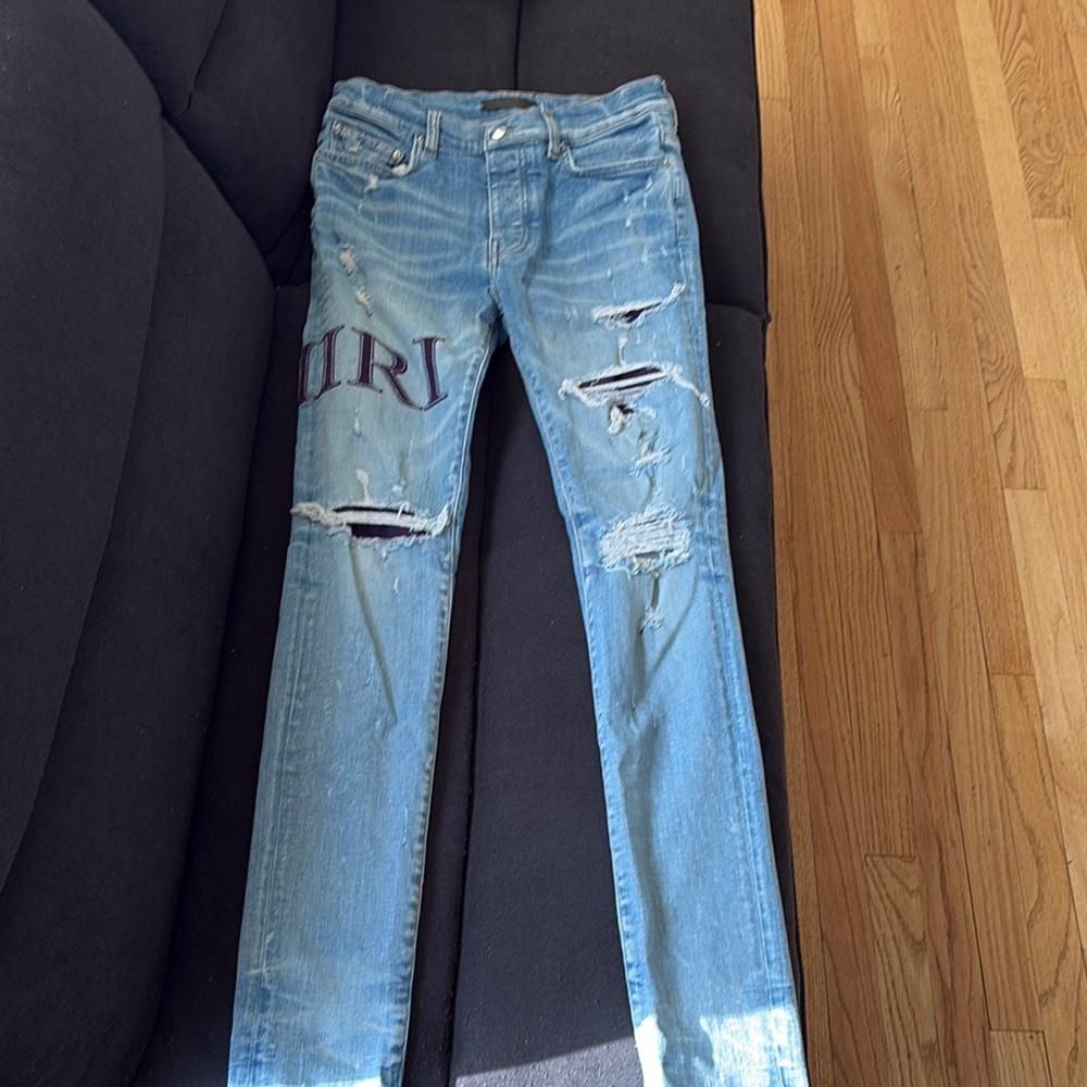 Distressed Light Blue Jeans With Patch - image 1